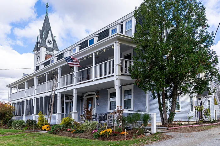 two-story-wraparound-porch-exterior-renovation.webp